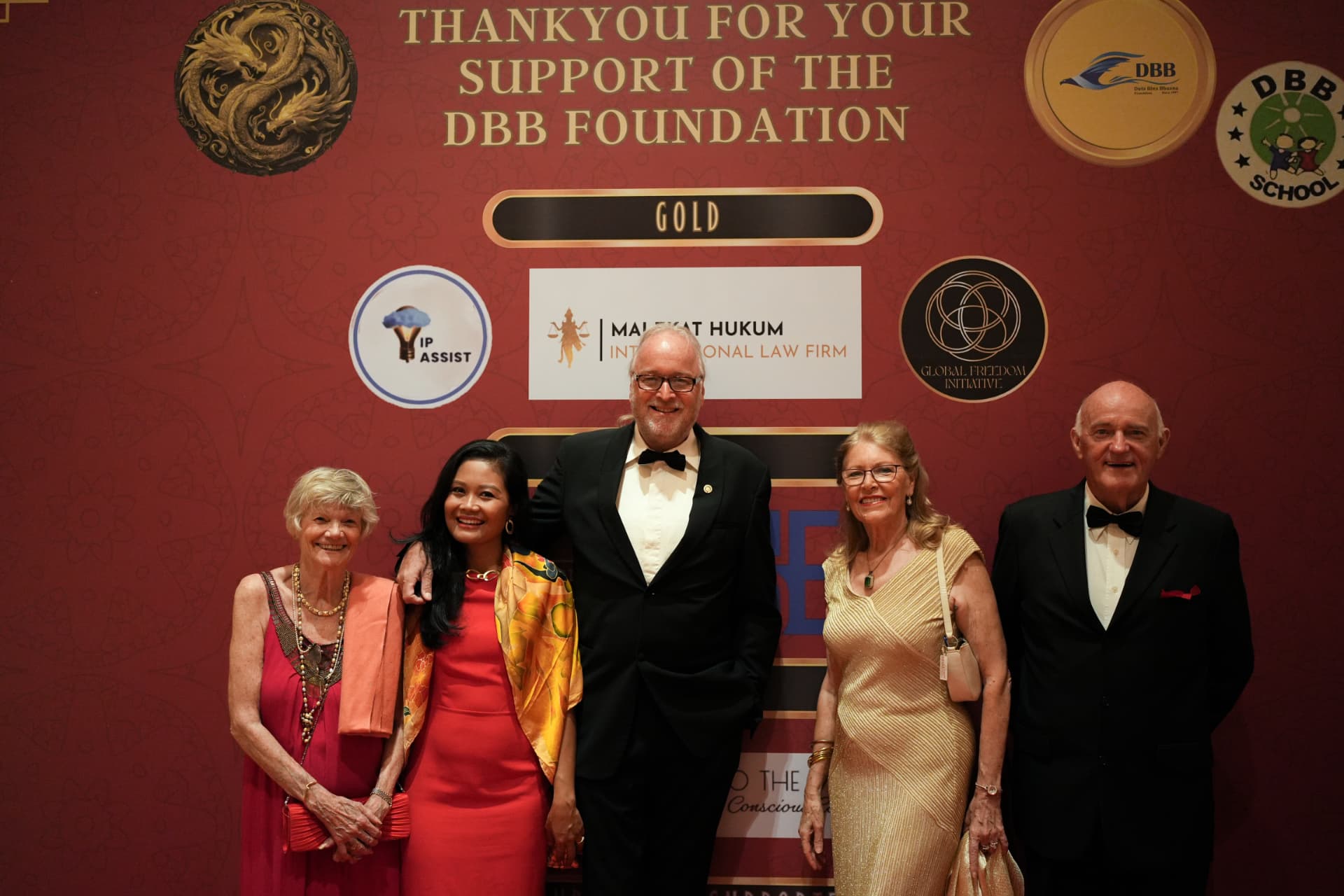 Guests in evening dress at a formal foundation gala