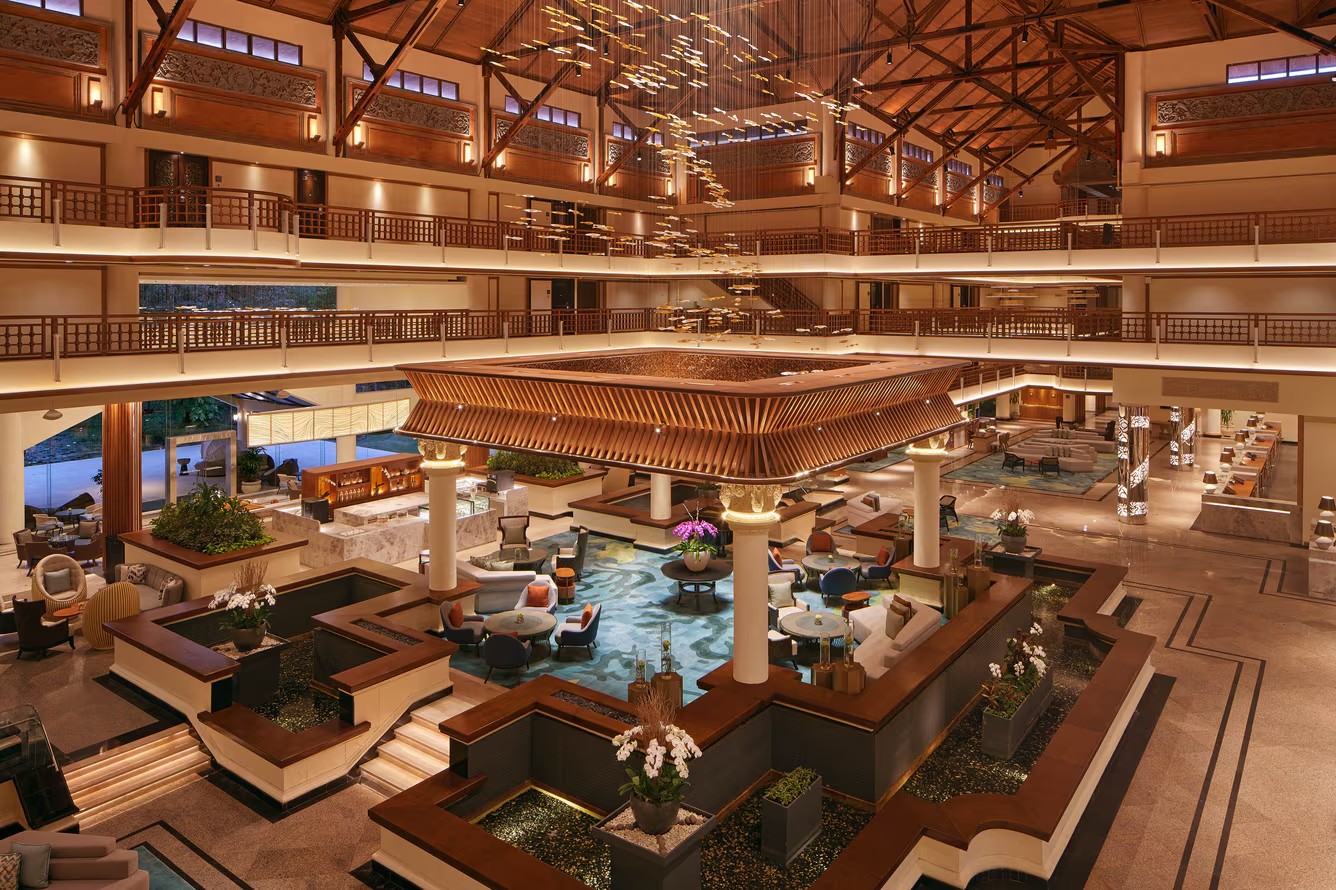 The Westin Resort Nusa Dua lobby atrium with a timber canopy and lounge seating